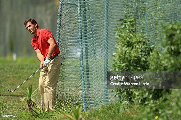 Gabriel Canizares of Spain struggles to play his second shot on the seventh hole during the fourth round of the Open de Andalucia 2010 at Parador de...