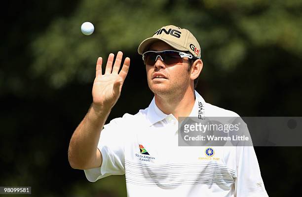 Louis Oosthuizen of South Africa catches his ball on the sixth green during the fourth round of the Open de Andalucia 2010 at Parador de Malaga Golf...