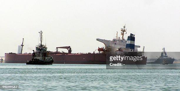 Tonne tanker flying a Liberian flag is seen stuck at the Suez canal on March 28, 2010 near Ismailia city, 120 kms north east of Cairo. Traffic in...