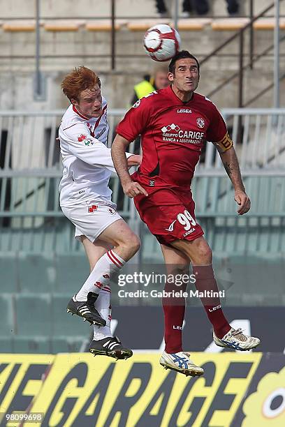 Cristiano Lucarelli of AS Livorno Calcio battles for the ball with Alessandro Gazzi of AS Bari during the Serie A match between AS Livorno Calcio and...