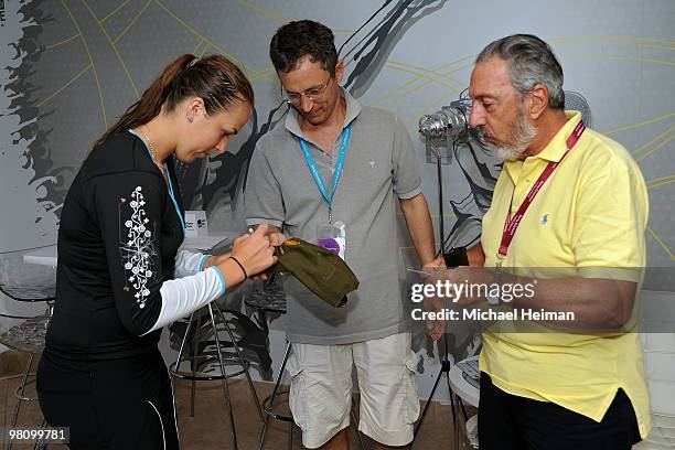 Anastasia Pavlyuchenkova of Russia signs autographs for fans during day five of the 2010 Sony Ericsson Open at Crandon Park Tennis Center on March...