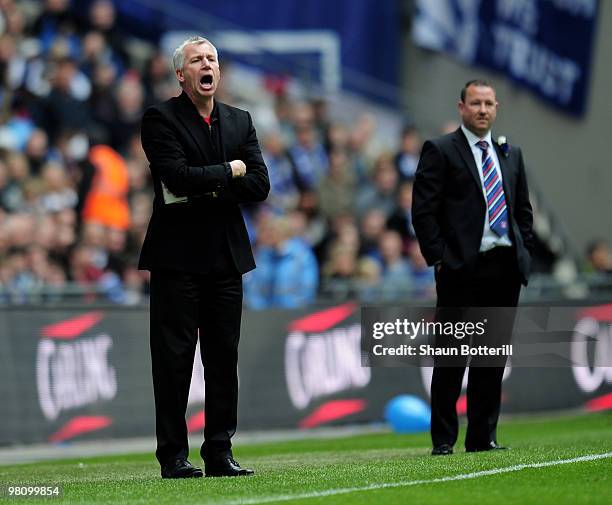 Alan Pardew the Southampton manager shouts intructions as Carlisle United manager Greg Abbott looks on during the Johnstone's Paint Trophy Final...