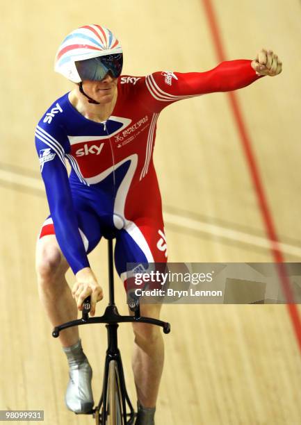 Ed Clancy of Great Britain punches the air after winning the Men's Omnium on day five of the UCI Track Cycling World Championships at the Ballerup...