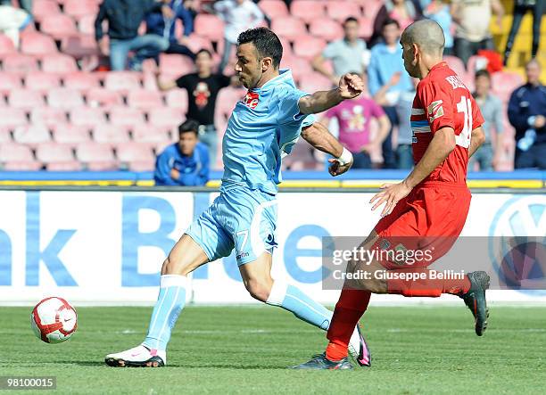 Fabio Quagliarella of Napoli and Giuseppe Bellusci of Catania in action during the Serie A match between SSC Napoli and Catania Calcio at Stadio San...