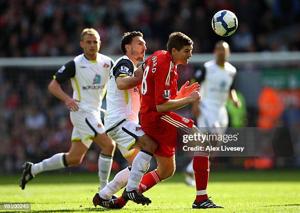 Steed Malbranque of Sunderland challenges Steven Gerrard of Liverpool during the Barclays Premier League match between Liverpool and Sunderland at...