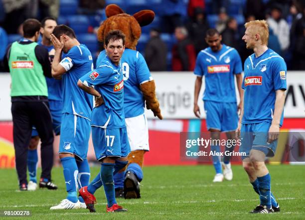 Tobias Weis of Hoffenheim and team mates react after the Bundesliga match between 1899 Hoffenheim and SC Freiburg at the Rhein-Neckar Arena on March...