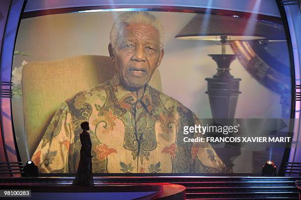 Former South African President Nelson Mandela speaks via video to the guests at the Cape Town International Convention Centre for the World Cup 2010...