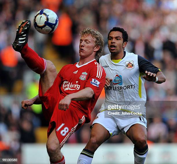 Dirk Kuyt of Liverpool competes with Kieran Richardson of Sunderland during the Barclays Premier League match between Liverpool and Sunderland at...