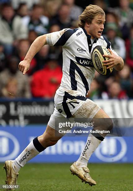 Matthew Tait of Sale Sharks runs with the ball during the Guinness Premiership match between London Irish and Sale Sharks at the Madejski Stadium on...