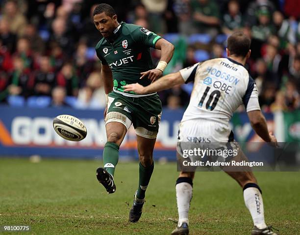 Delon Armitage of London Irish chips the ball past Charlie Hodgson of Sale Sharks during the Guinness Premiership match between London Irish and Sale...