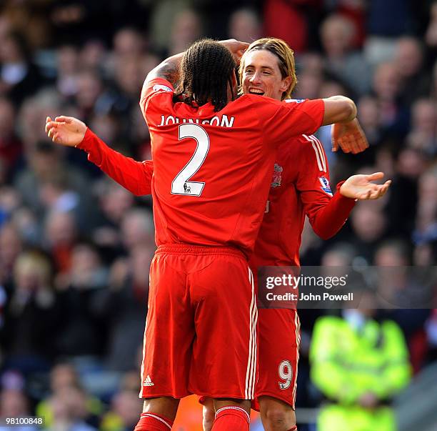 Fernando Torres of Liverpool celebrates with Glen Johnson the two goal scorers during the Barclays Premier League match between Liverpool and...