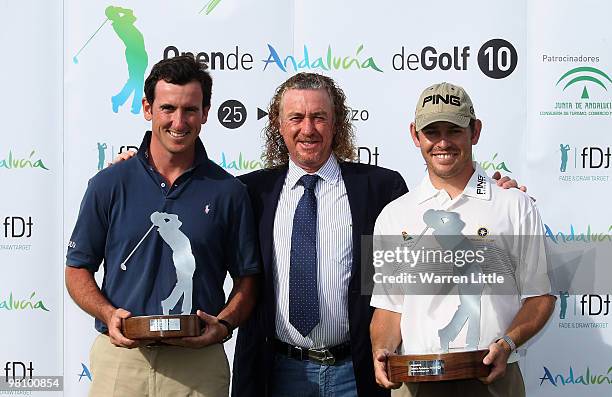 Louis Oosthuizen of South Africa poses with Gonzalo Fernandez-Castano and Miguel Angel Jimenez of Spain after winning the Open de Andalucia 2010 on a...