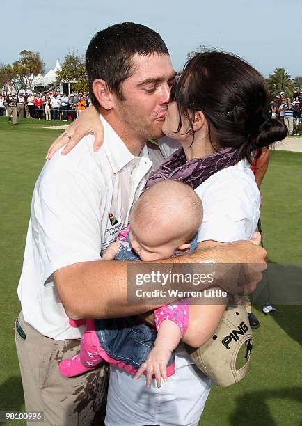 Louis Oosthuizen of South Africa celebrates with his wife Nel-Mare and new born daughter Jana after winning the Open de Andalucia 2010 on a score of...