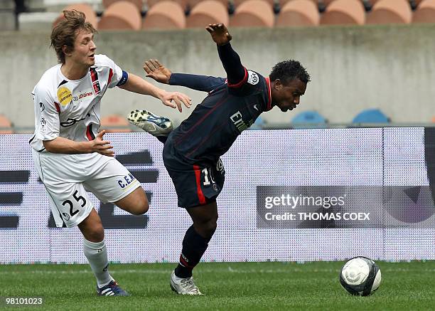 Paris Saint-Germain's midfielder Stephane Sessegnon vies with Boulogne's midfielder Damien Marcq during the French L1 football match PSG vs...