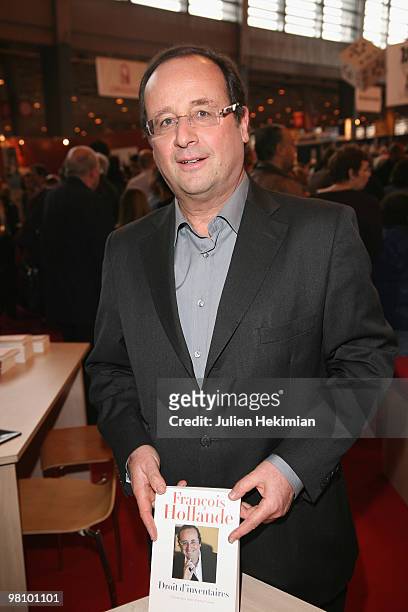 Francois Hollande signs copies of hir book 'Droit d'inventaires' at the 30th salon du livre at Porte de Versailles on March 28, 2010 in Paris, France.