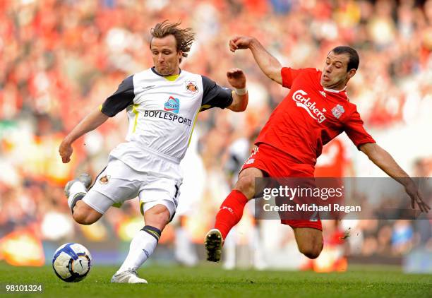 Bolo Zenden of Sunderland is tackled by Javier Mascherano of Liverpool during the Barclays Premier League match between Liverpool and Sunderland at...