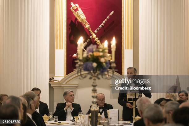 Philip Hammond, U.K. Chancellor of the exchequer, center left, listens as Mark Carney, governor of the Bank of England , speaks at the annual Mansion...
