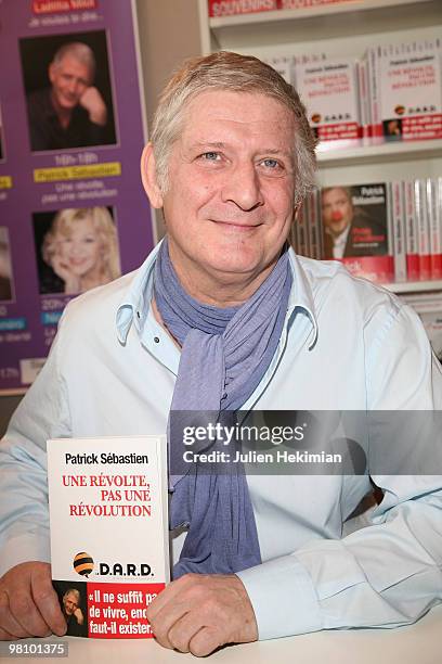 Patrick Sebastien signs copies of his book 'Une revolte pas une revolution' at the 30th salon du livre at Porte de Versailles on March 28, 2010 in...