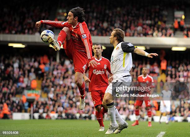 Bolo Zenden of Sunderland is beaten to the ball by Alberto Aquilani of Liverpool during the Barclays Premier League match between Liverpool and...