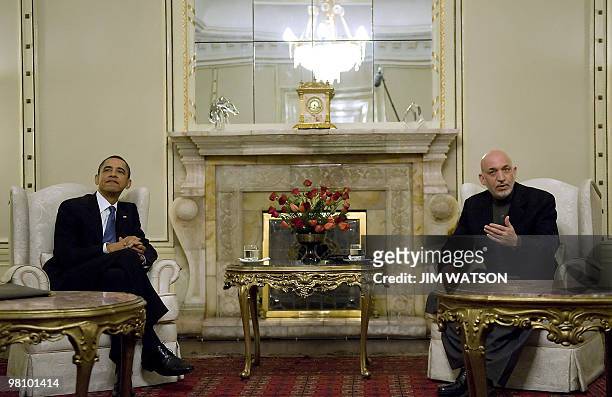 President Barack Obama speaks with Afghan President Hamid Karzai during a meeting at the Presidential Palace in Kabul on March 28, 2010. Obama landed...