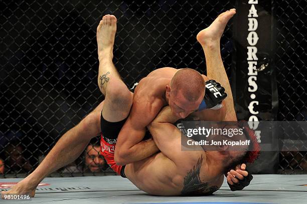 Fighter Georges St-Pierre battles Dan Hardy during their Welterweight title bout at UFC 111 at the Prudential Center on March 27, 2010 in Newark, New...