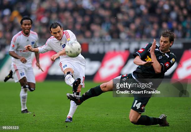 Piotr Trochowski of Hamburg is challenged by Thorben Marx of Gladbach during the Bundesliga match between Borussia Moenchengladbach and Hamburger SV...
