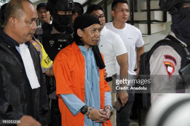 Defendant of terrorism case of Aman Abdurrahman, also known as Oman, before undergoing hearing of decision on him in South Jakarta District Court,...