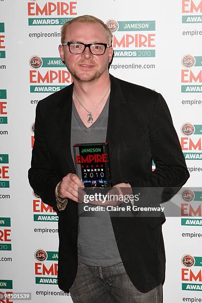 Actor Simon Pegg poses with the award for Best Sci-Fi/Fantasy at the Winners Boards at the Jameson Empire Film Awards held at the Grosvenor House...