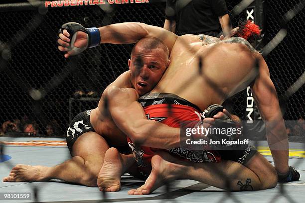 Fighter Georges St-Pierre battles Dan Hardy during their Welterweight title bout at UFC 111 at the Prudential Center on March 27, 2010 in Newark, New...