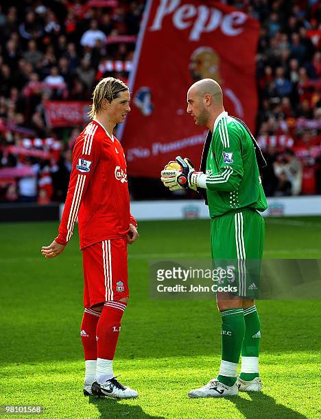 Fernando Torres of Liverpool talks to Pepe Reina also of Liverpool in front of the new Pepe flag during the Barclays Premier League match between...