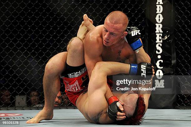 Fighter Georges St-Pierre battles Dan Hardy during their Welterweight title bout at UFC 111 at the Prudential Center on March 27, 2010 in Newark, New...