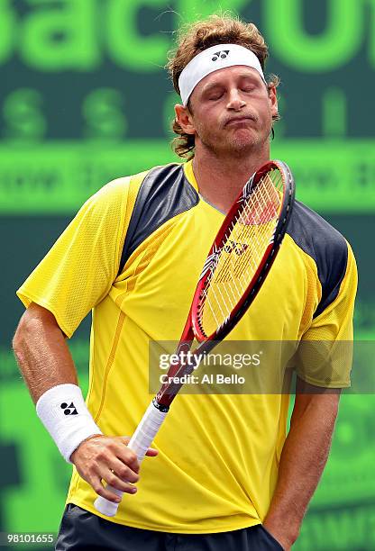 David Nalbandian of Argentina reacts after a shot against Rafael Nadal of Spain during day six of the 2010 Sony Ericsson Open at Crandon Park Tennis...