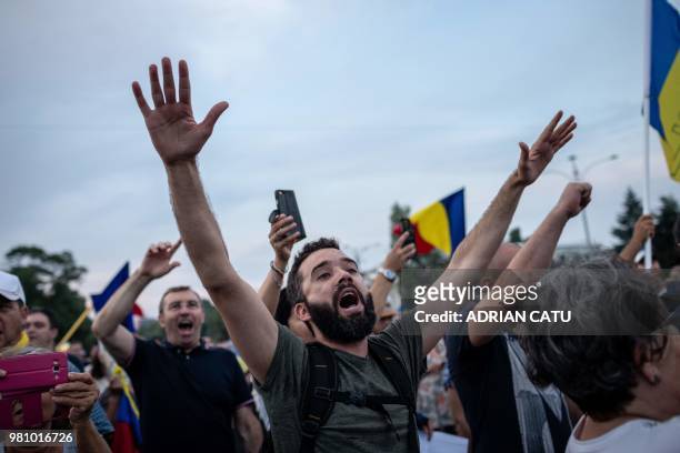 Demonstrators gather in front of the Romanian Prime Minister's office building on June 21, 2018 in Bucharest, Romania. - Around 5,000 people gathered...