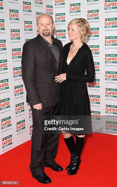 Director Neil Marshall and wife actress Axelle Carolyn attend the Jameson Empire Film Awards held at Grosvenor House Hotel, on March 28, 2010 in...