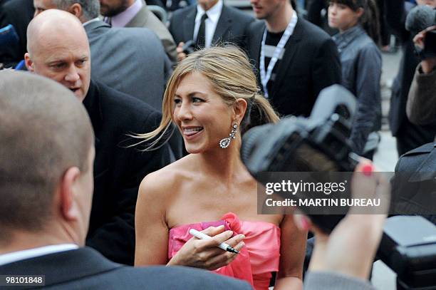 Actress Jennifer Aniston arrives on the Champs-Elysees avenue for the premiere of the movie "Bounty Hunter" directed by US Andy Tennant on March 28,...