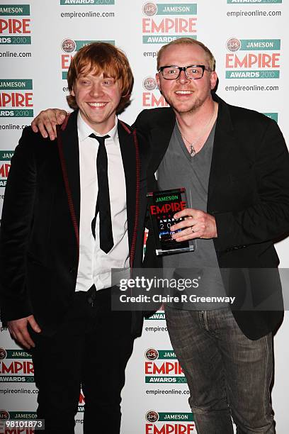 Rupert Grint and Simon Pegg pose at the Winners Boards at the Jameson Empire Film Awards held at the Grosvenor House Hotel, on March 28, 2010 in...