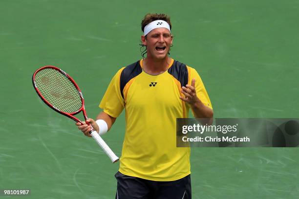 David Nalbandian of Argentina reacts after a shot against Rafael Nadal of Spain during day six of the 2010 Sony Ericsson Open at Crandon Park Tennis...