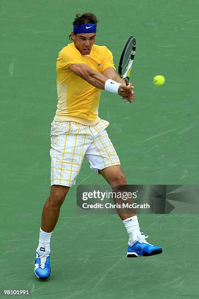 Rafael Nadal of Spain returns a shot against David Nalbandian of Argentina during day six of the 2010 Sony Ericsson Open at Crandon Park Tennis...