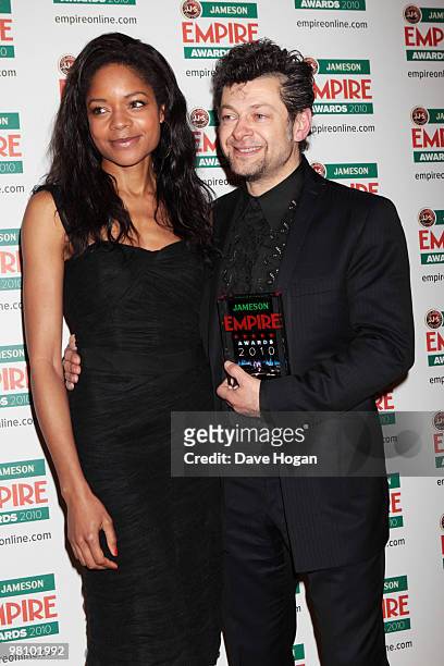 Naomie Harris poses with Andy Serkis after presenting him with the Empire inspiration award in front of the winners boards at the Jameson Empire Film...