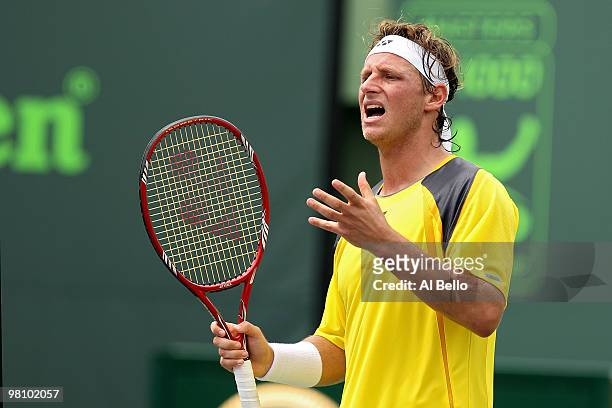 David Nalbandian of Argentina reacts after a shot against Rafael Nadal of Spain during day six of the 2010 Sony Ericsson Open at Crandon Park Tennis...
