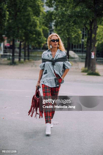 Elina Halimi outside AMI during Paris Fashion Week Mens Spring/Summer 2019 on June 21, 2018 in Paris, France.