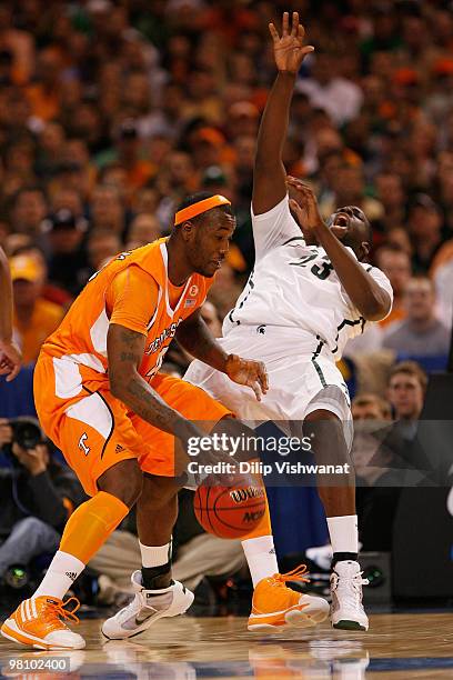 Wayne Chism of the Tennessee Volunteers drives to the basket against Draymond Green of the Michigan State Spartans during the midwest regional final...