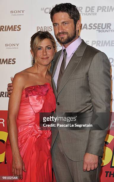 Actress Jennifer Aniston and Gerard Butler arrive to attend the Premiere of the film "Le chasseur de Primes" at Cinema Gaumont Marignan on March 28,...