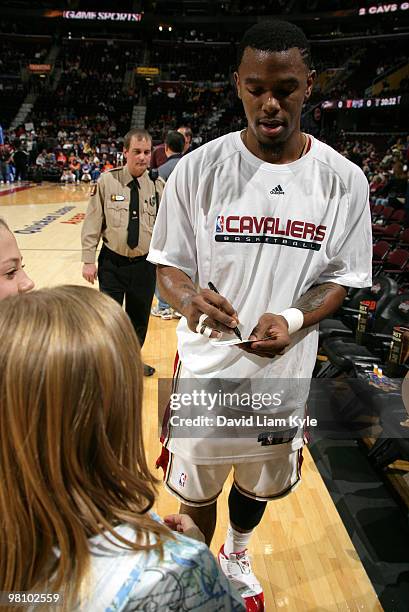 Daniel Gibson of the Cleveland Cavaliers signs an autograph for a fan prior to the game against the Sacramento Kings on March 28, 2010 at The Quicken...