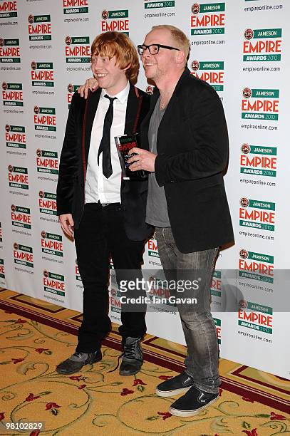Rupert Grint and Simon Pegg pose with the award for Best Sci Fi/Fantasy at the Winners Boards at the Jameson Empire Film Awards held at the Grosvenor...