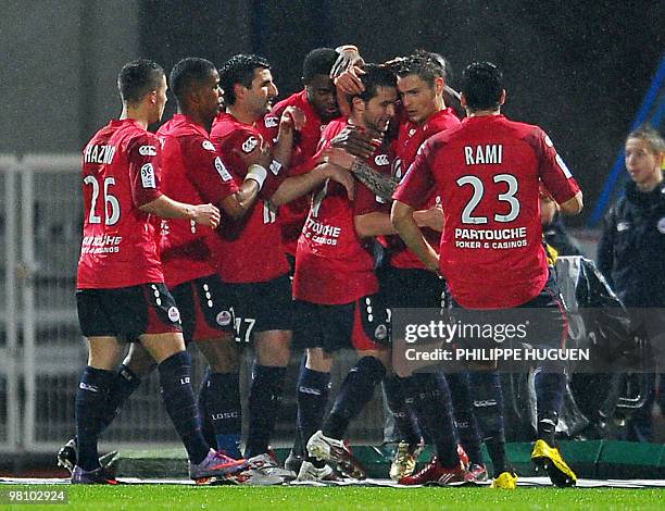 Lille's French midfielder Yohan Cabaye is congratuled by teammates after scoring during the L1 football match Lille vs Montpellier on March 28, 2010...