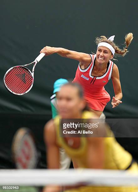 Gisela Dulko of Argentina and Flavia Pennetta of Italy play against Nuria Llagostera Vives of Spain and Maria Jose Martinez Sanchez of Spain during...