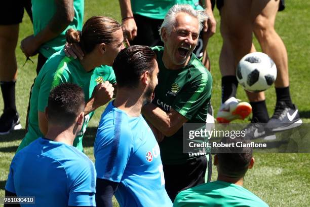 Bert van Marwijk, Head coach of Australia and Jackson Irvine of Australia laugh as players look on during an Australian Socceroos training session at...