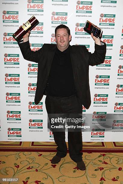 Johnny Vegas poses with the award for Best Actress collected on behalf of Zoe Saldana at the Winners Boards at the Jameson Empire Film Awards held at...