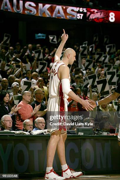 Zydrunas Ilgauskas of the Cleveland Cavaliers acknowledges the fans as he takes the court for the first time at home following his reaquisition...